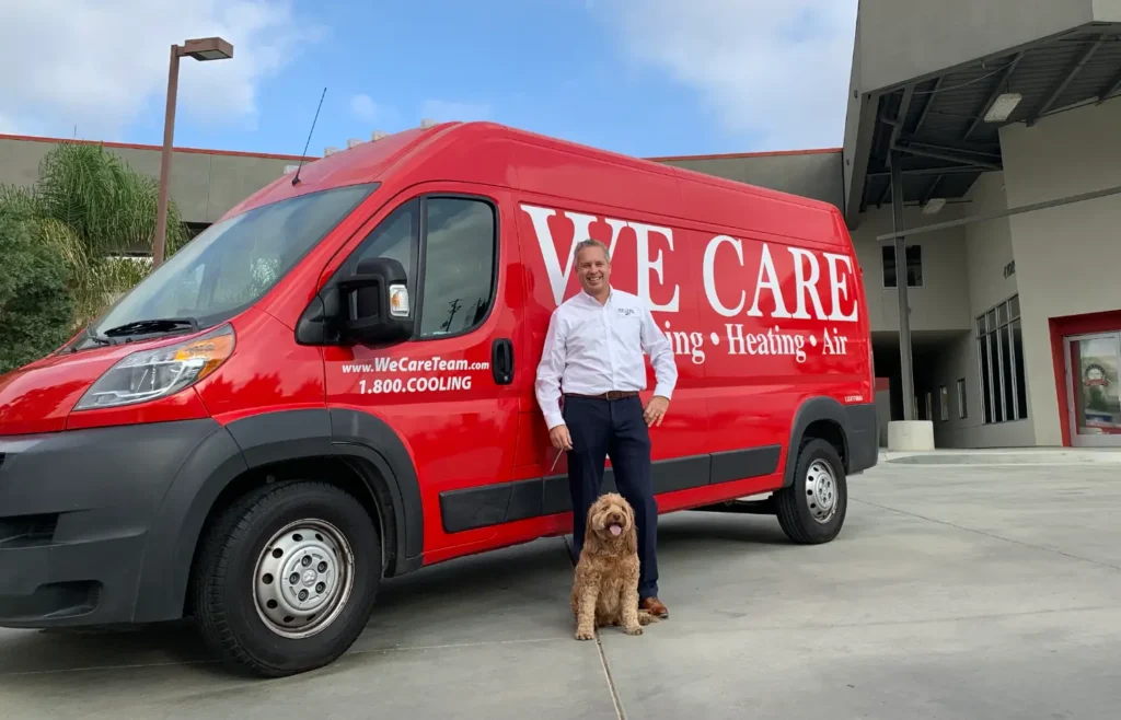 We Care owner in front of van with dog